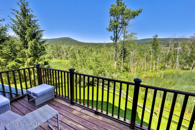 a view of a two chairs in the balcony