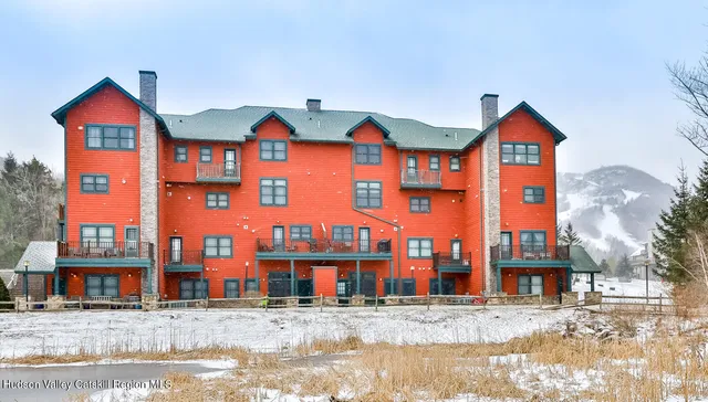 a view of a brick building next to a road