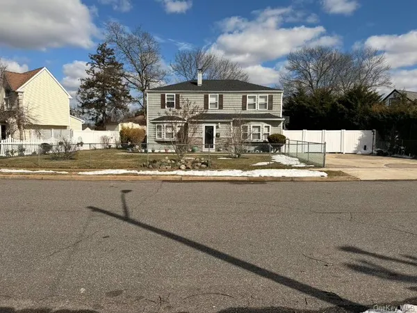 a view of a house with a yard and balcony