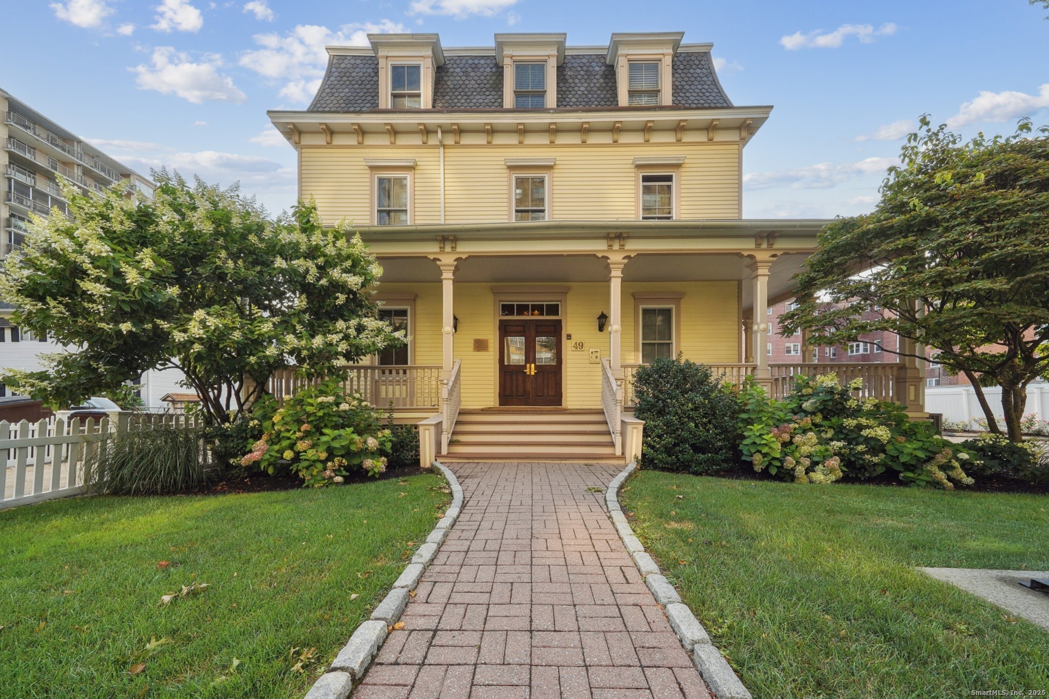 a front view of a house with garden