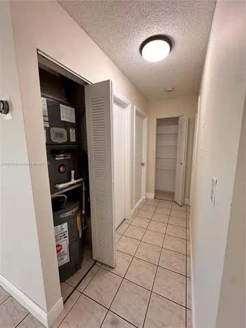 a view of kitchen with furniture and cabinets