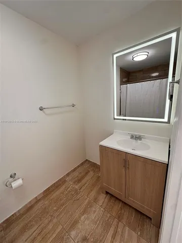 a bathroom with a sink and mirror