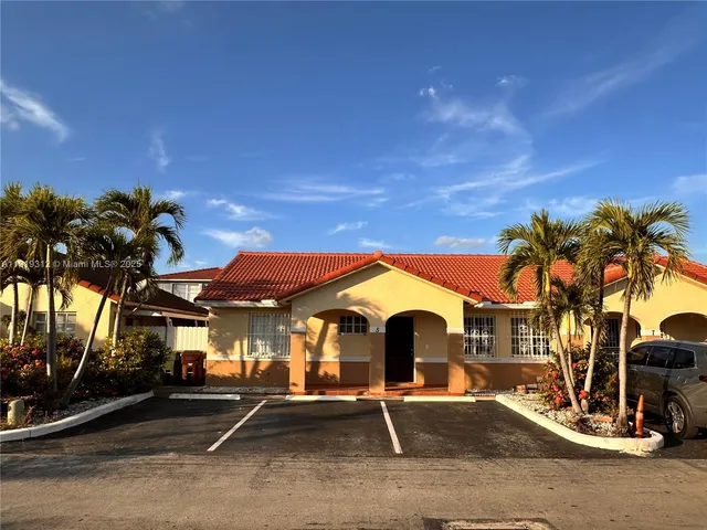 a view of a park with swings and slides