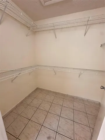 a view of an empty walk in closet