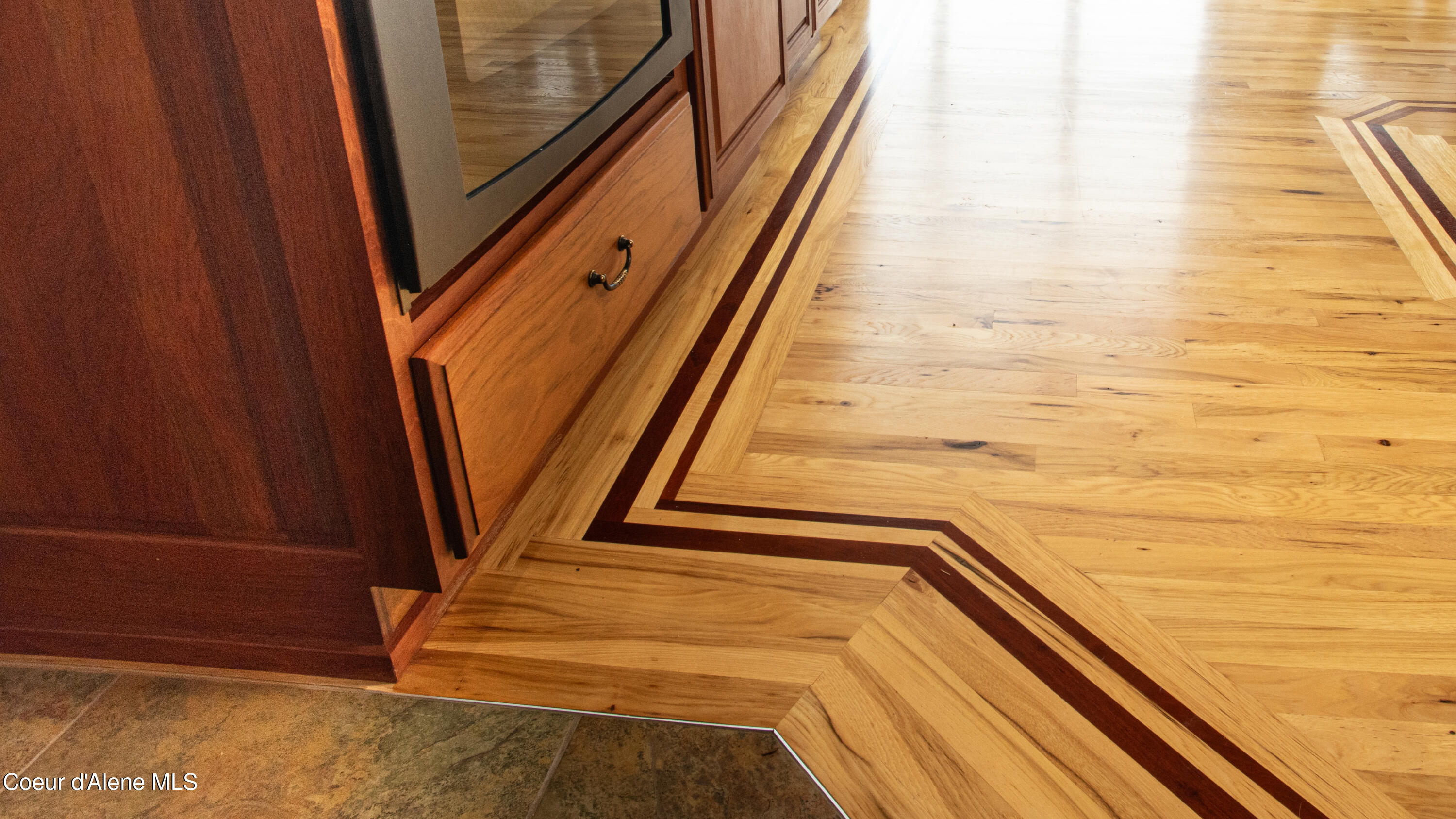 3361 Bottle Bay Road Sagle, ID 83860 - Photo 14 of 31 11 - Kitchen Cabinetry and Floor Inlay D