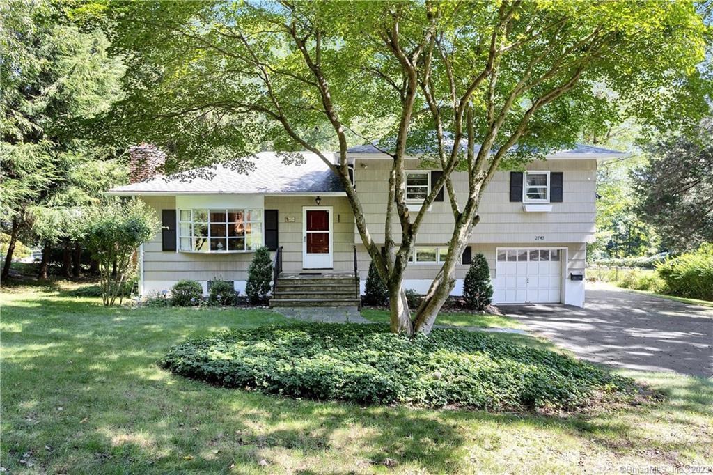 2745 High Ridge Road Stamford, CT 06903 - Photo 1 of 1 a front view of a house with a yard