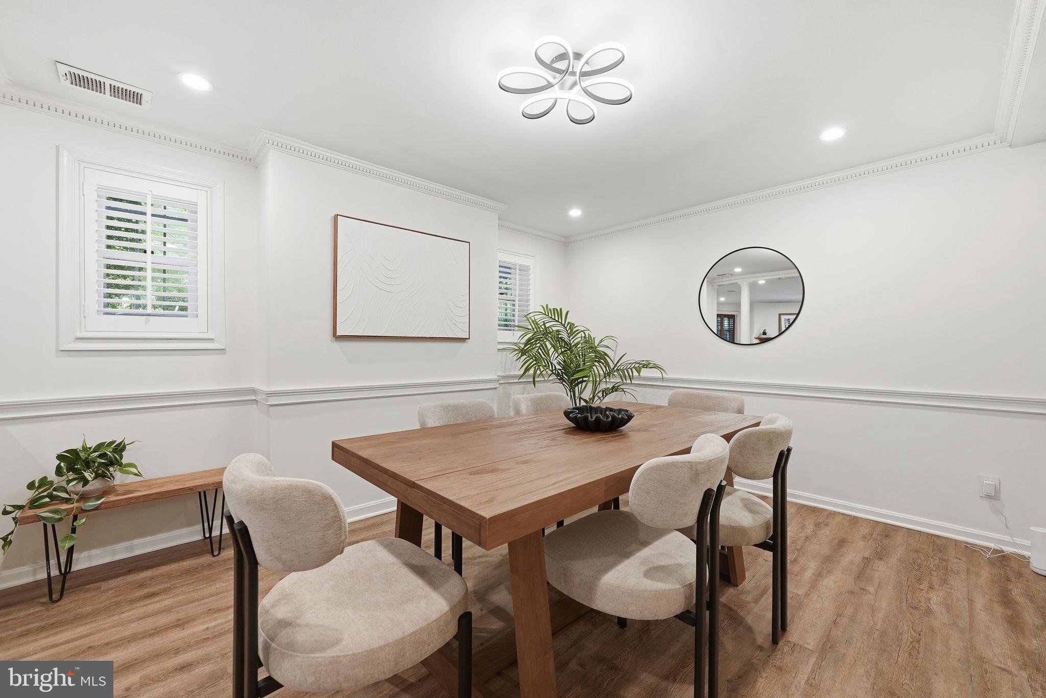 1200 East Capitol Street Northeast, Unit 1 Washington, DC 20002 - Photo 9 of 31 a view of a dining room with furniture and wooden floor