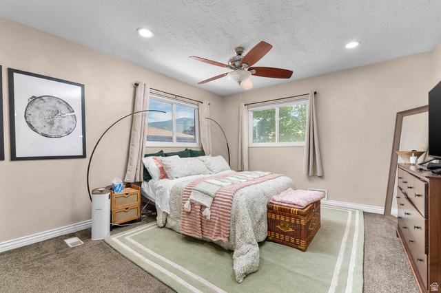 1489 North 400 West Bountiful, UT 84010 - Photo 14 of 47 Carpeted bedroom featuring recessed lighting, a ceiling fan, and two windows