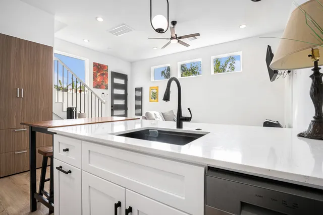a kitchen with a sink and a refrigerator