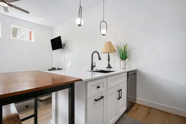 a kitchen with a sink and a stove