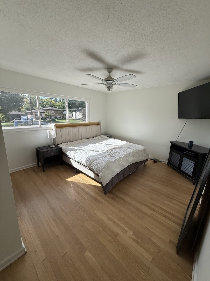 4326 151st Street Midlothian, IL 60445 - Photo 11 of 26 a bedroom with a bed and large window