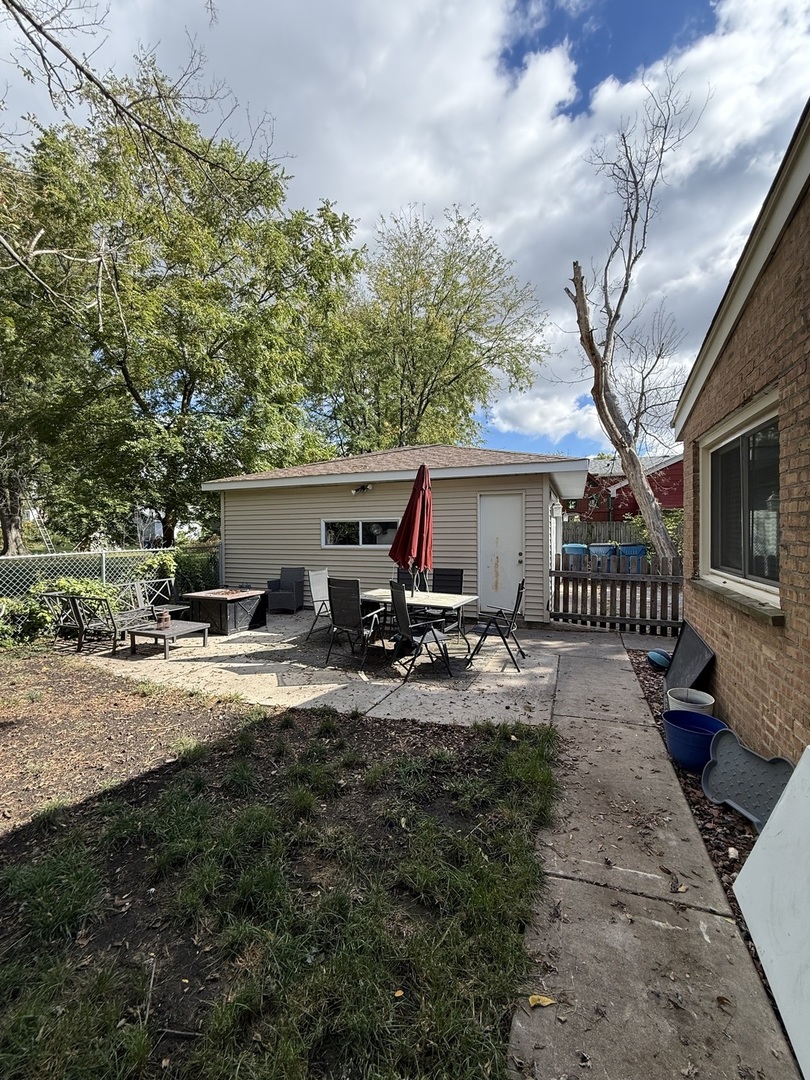 4326 151st Street Midlothian, IL 60445 - Photo 25 of 26 a view of a house with backyard and sitting area