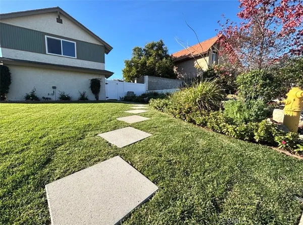 a view of a back yard of the house