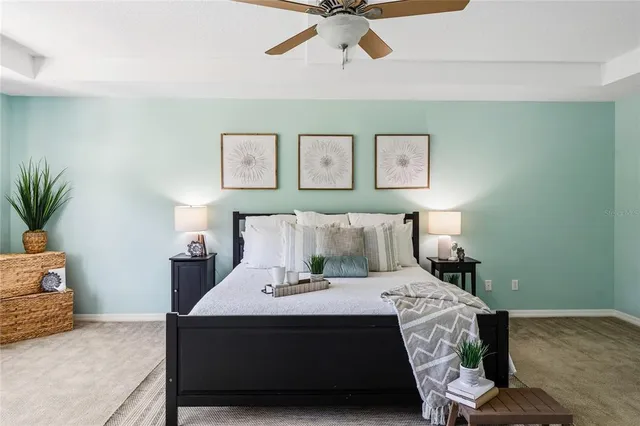 a spacious bedroom with a large bed and a window