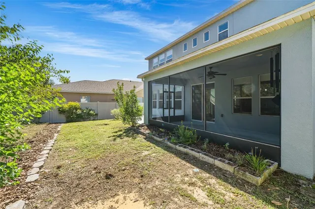 an aerial view of a house with a swimming pool