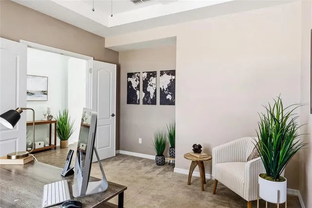 a view of a livingroom with furniture and a flat screen tv