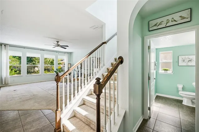 a view of a hallway with wooden floor and entryway