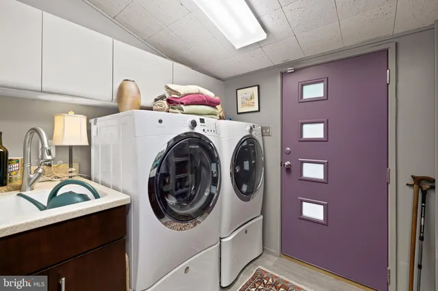 a kitchen with cabinets and appliances