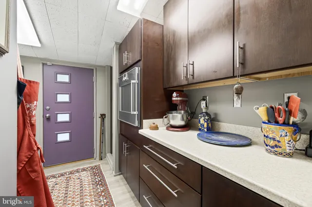 a view of hallway with furniture and a rug