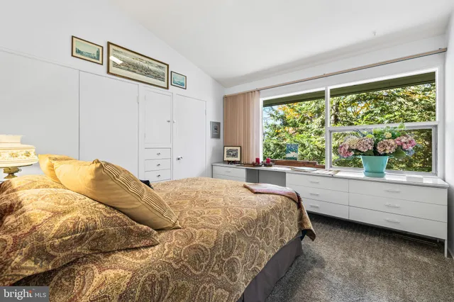 a room with furniture and a large window