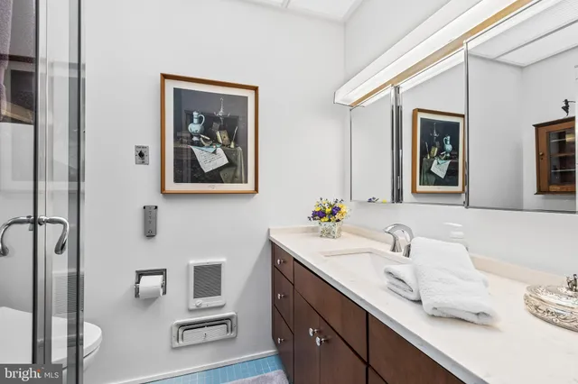 a bed sitting in a bedroom next to a large window