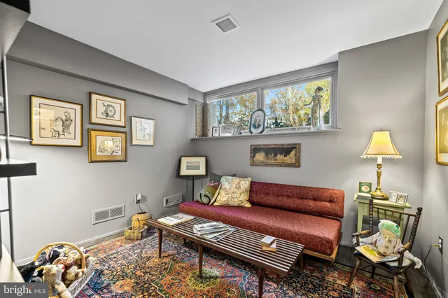 a view of backyard with table and chairs under an umbrella