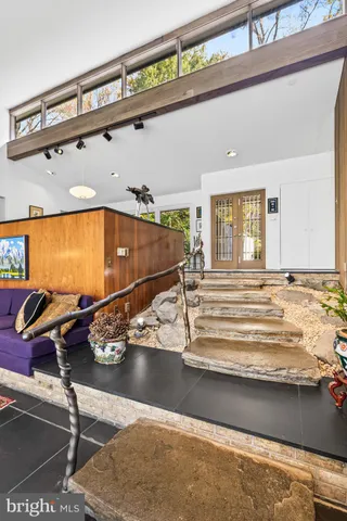 a living room with lots of furniture and a rug