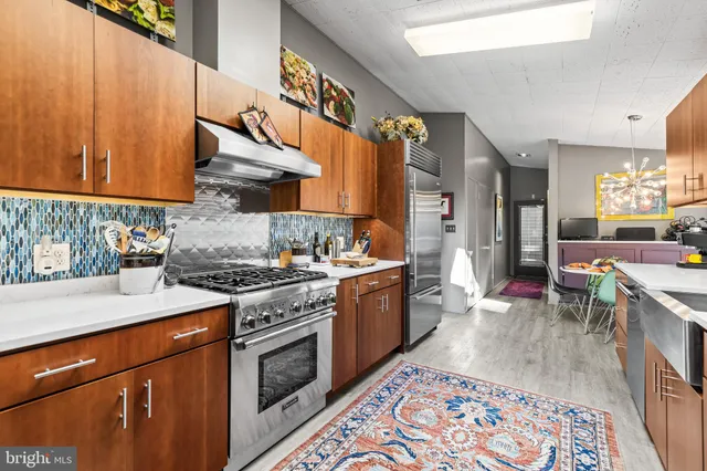 a kitchen with sink cabinets and outdoor view