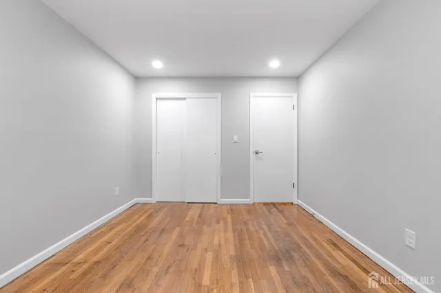 a view of room with wooden floor