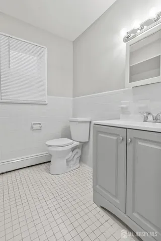 a bathroom with a toilet and a sink