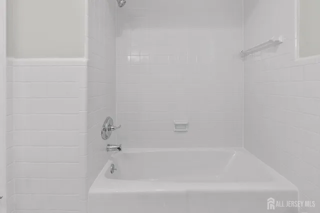 a close view of a bathtub in bathroom