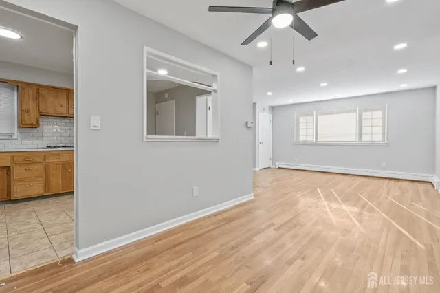 a view of an empty room with a window