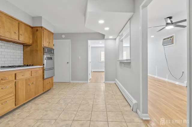 a view of a kitchen with electric appliances