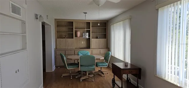 a workspace with furniture and a window