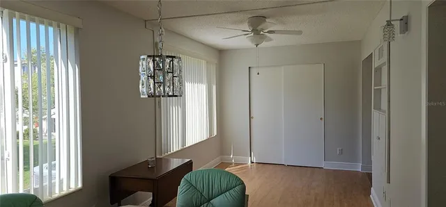 a view of a livingroom with furniture and windows