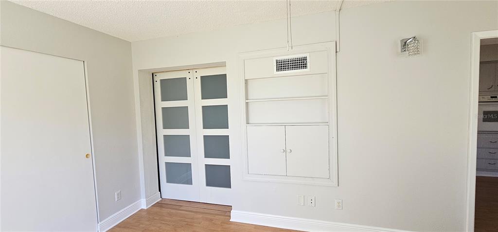 2450 Canadian Way, Unit 26 Clearwater, FL 33763 - Photo 16 of 32 a view of an empty room with cabinet