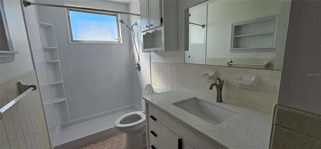 a bathroom with a sink and mirror
