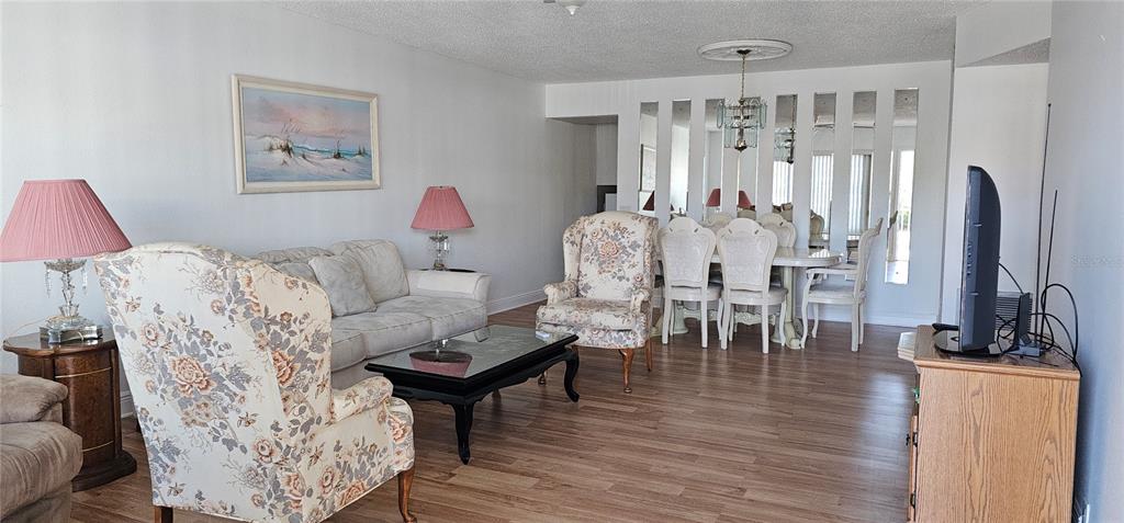 2450 Canadian Way, Unit 26 Clearwater, FL 33763 - Photo 2 of 32 a living room with furniture and a large window