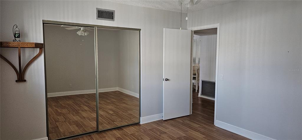2450 Canadian Way, Unit 26 Clearwater, FL 33763 - Photo 31 of 32 an empty room with wooden floor and closet