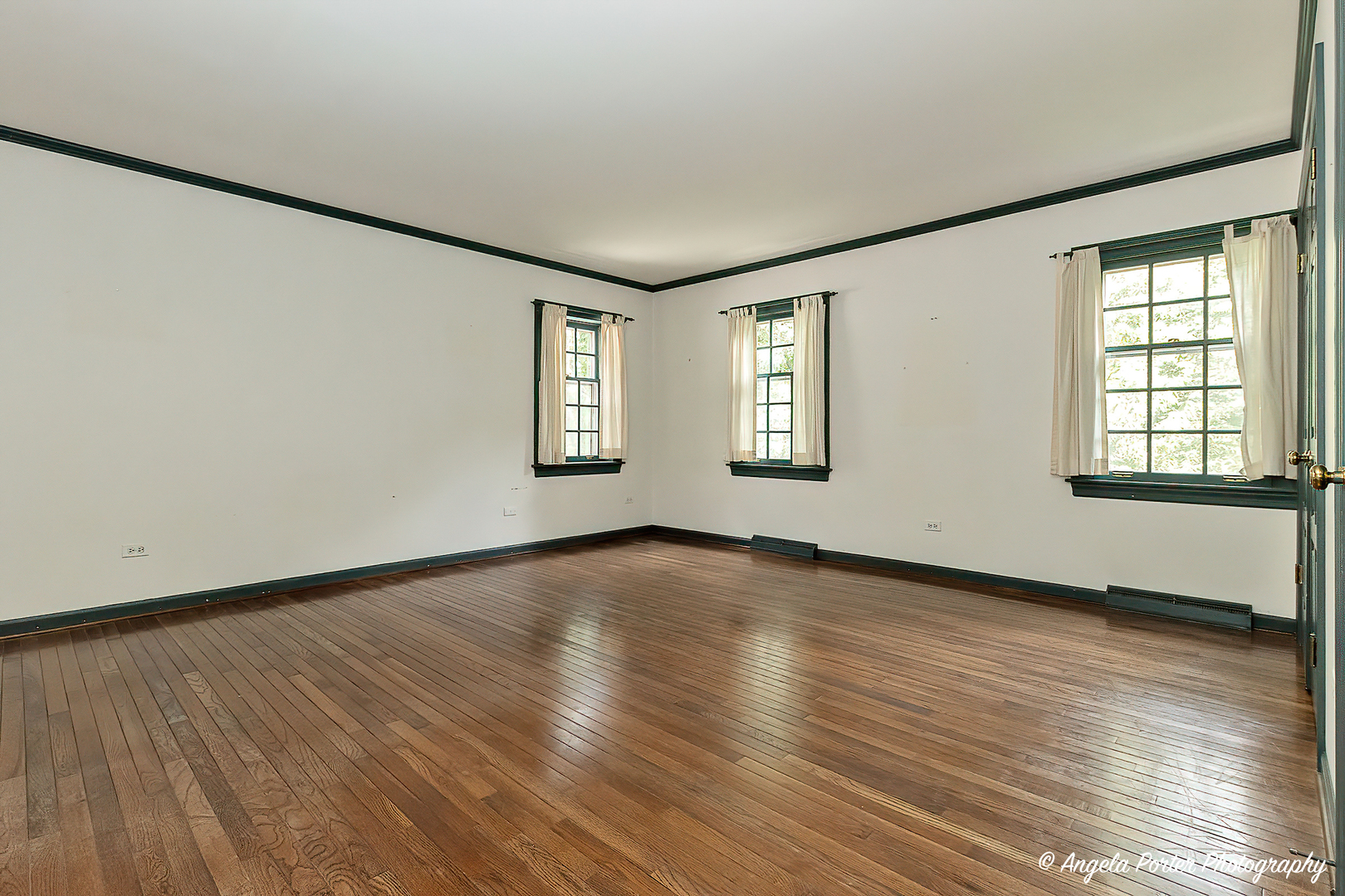 21293 North Andover Road Kildeer, IL 60047 - Photo 23 of 34 an empty room with wooden floor and windows