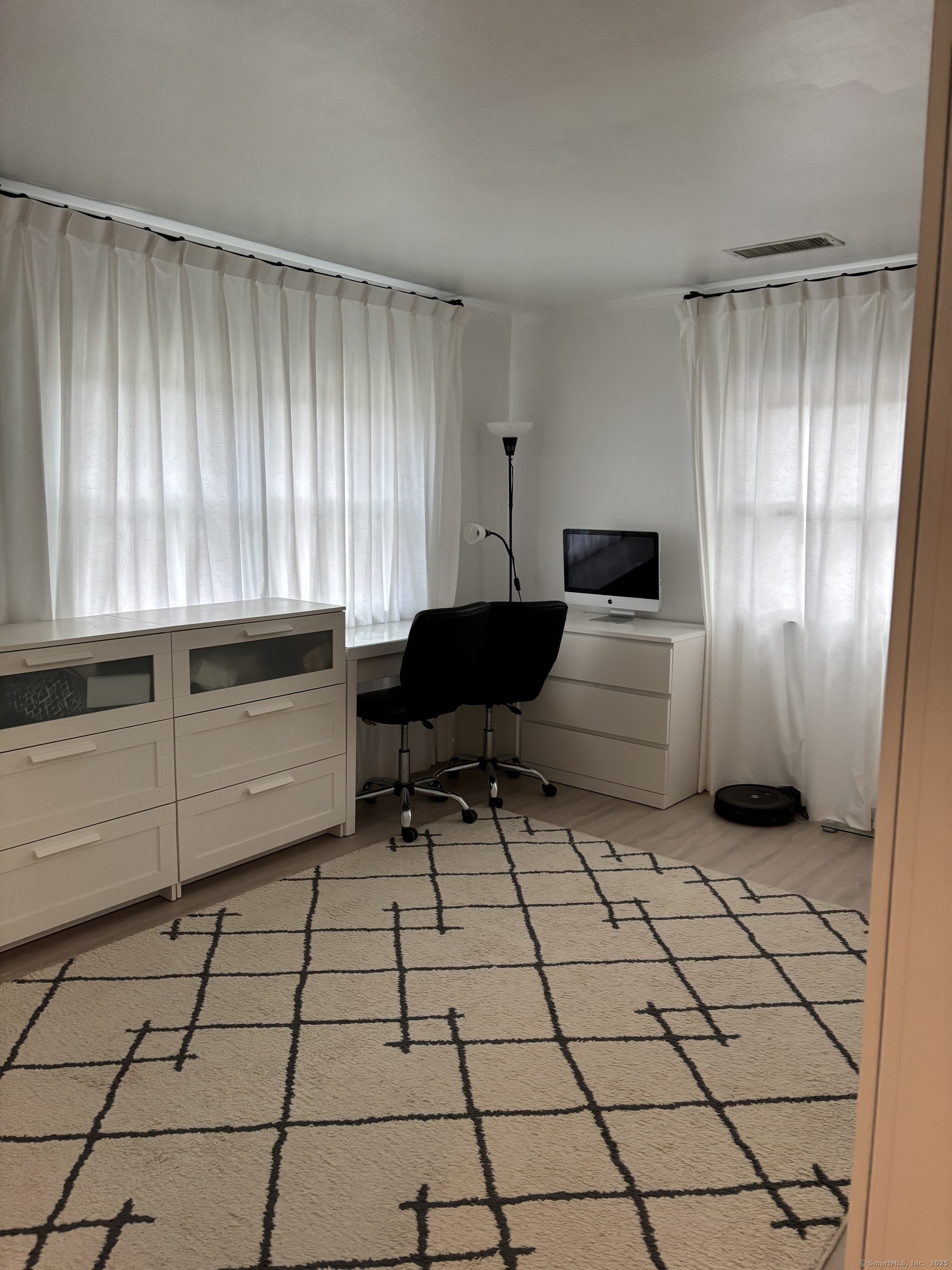 846 Beechwood Road Orange, CT 06477 - Photo 14 of 25 a living room with a black white checkered floor with a large window