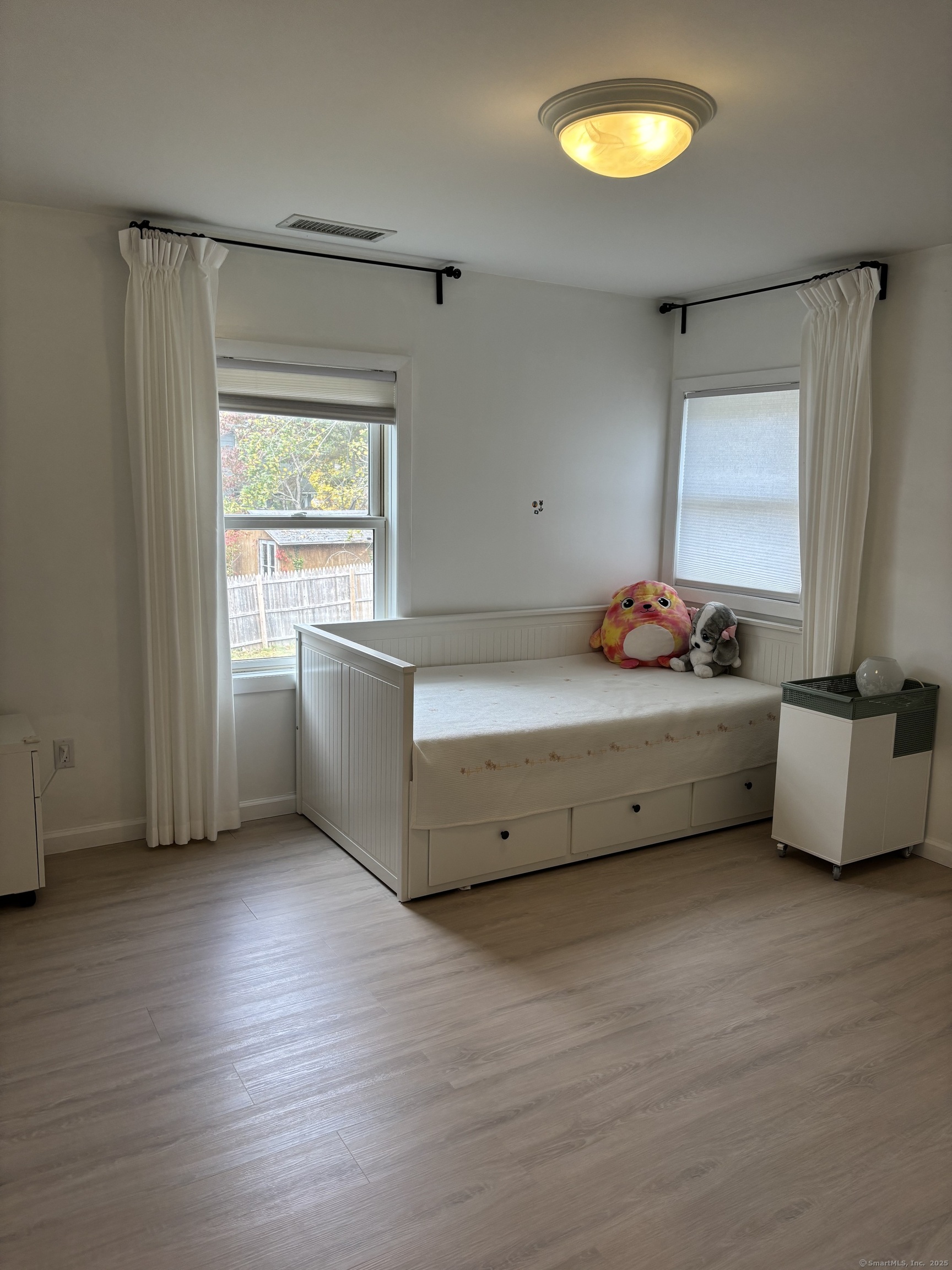 846 Beechwood Road Orange, CT 06477 - Photo 17 of 25 a room with furniture and window