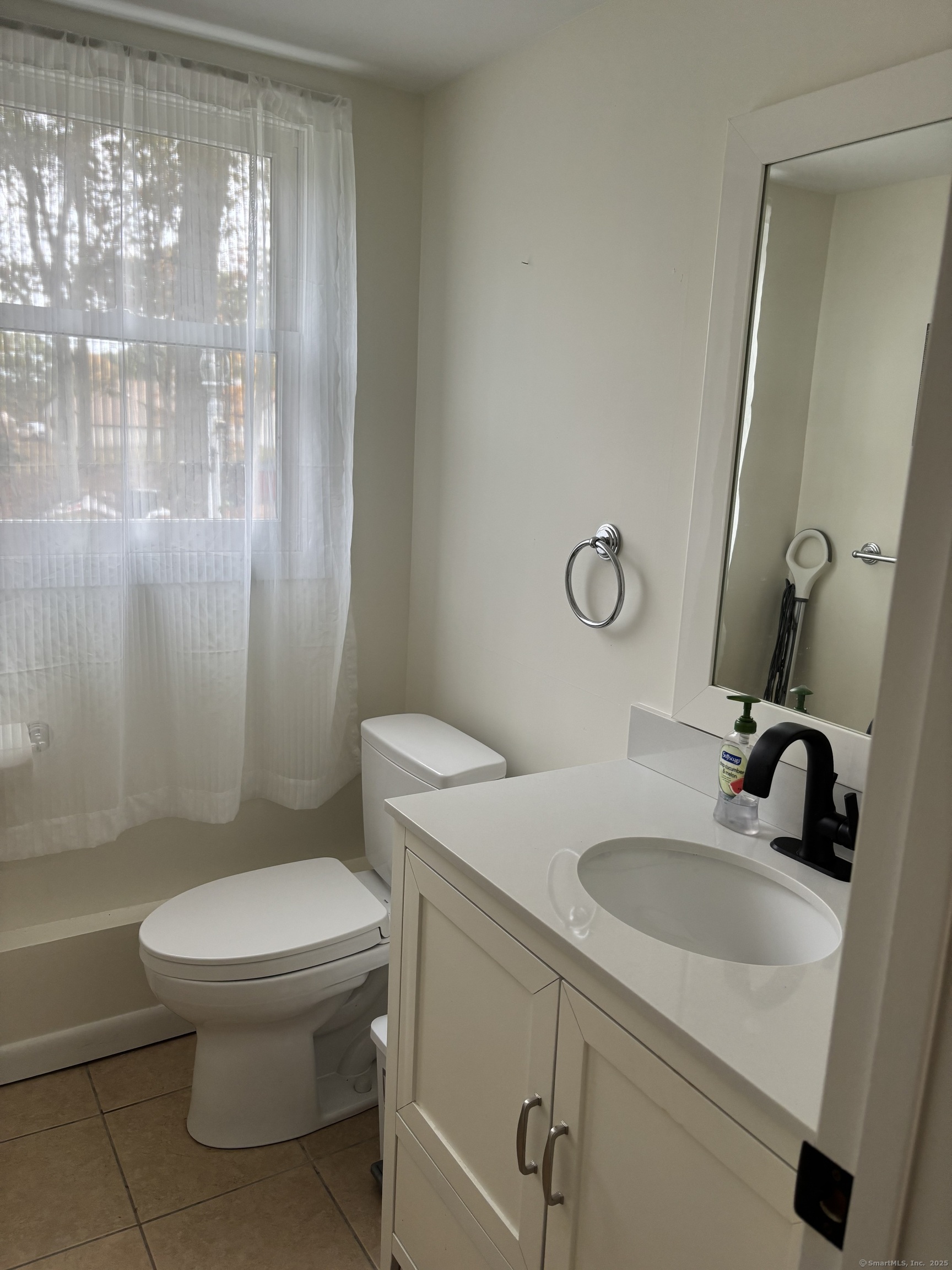 846 Beechwood Road Orange, CT 06477 - Photo 23 of 25 a bathroom with a sink a toilet and shower