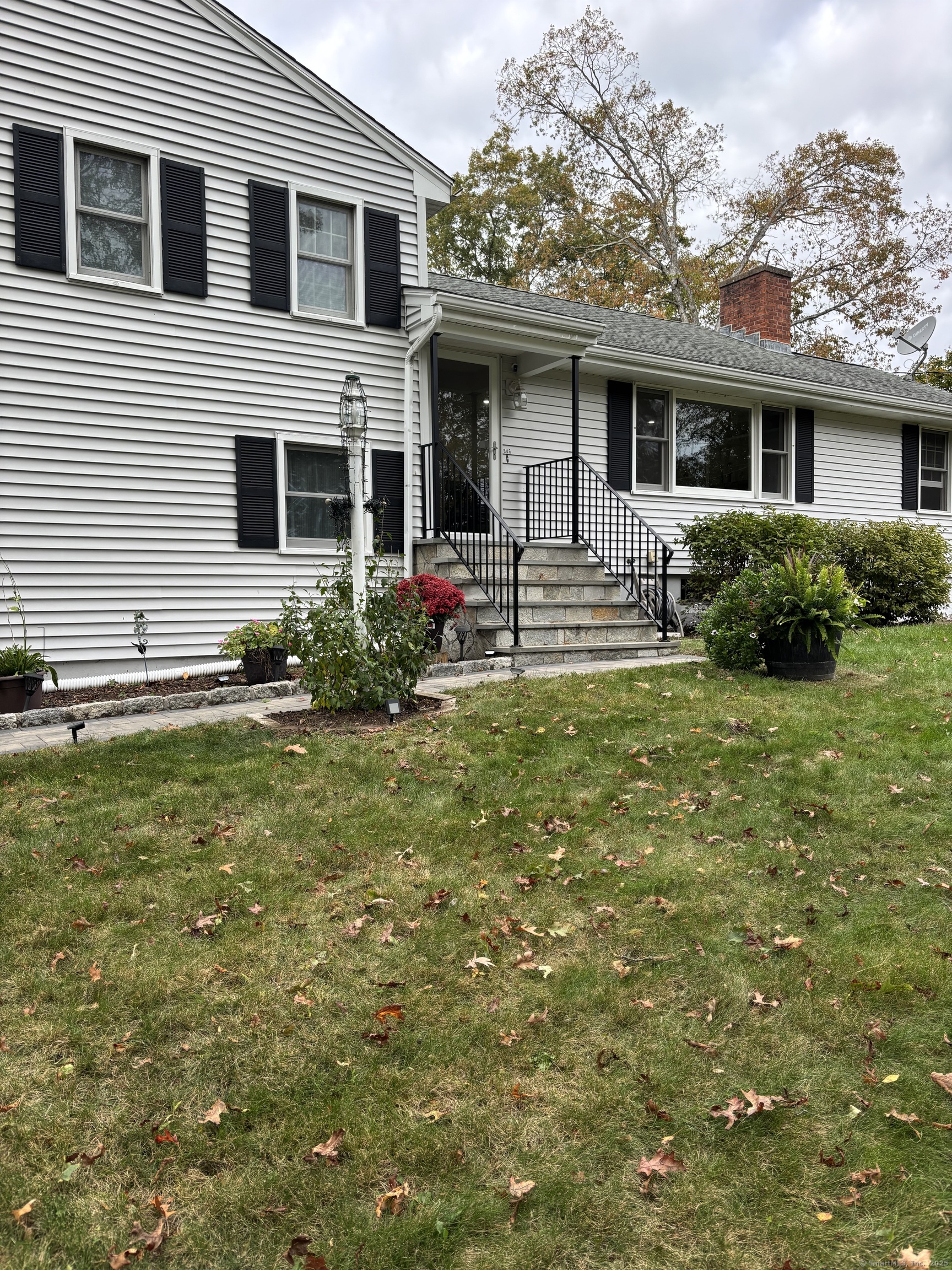846 Beechwood Road Orange, CT 06477 - Photo 3 of 25 a front view of house with yard and green space