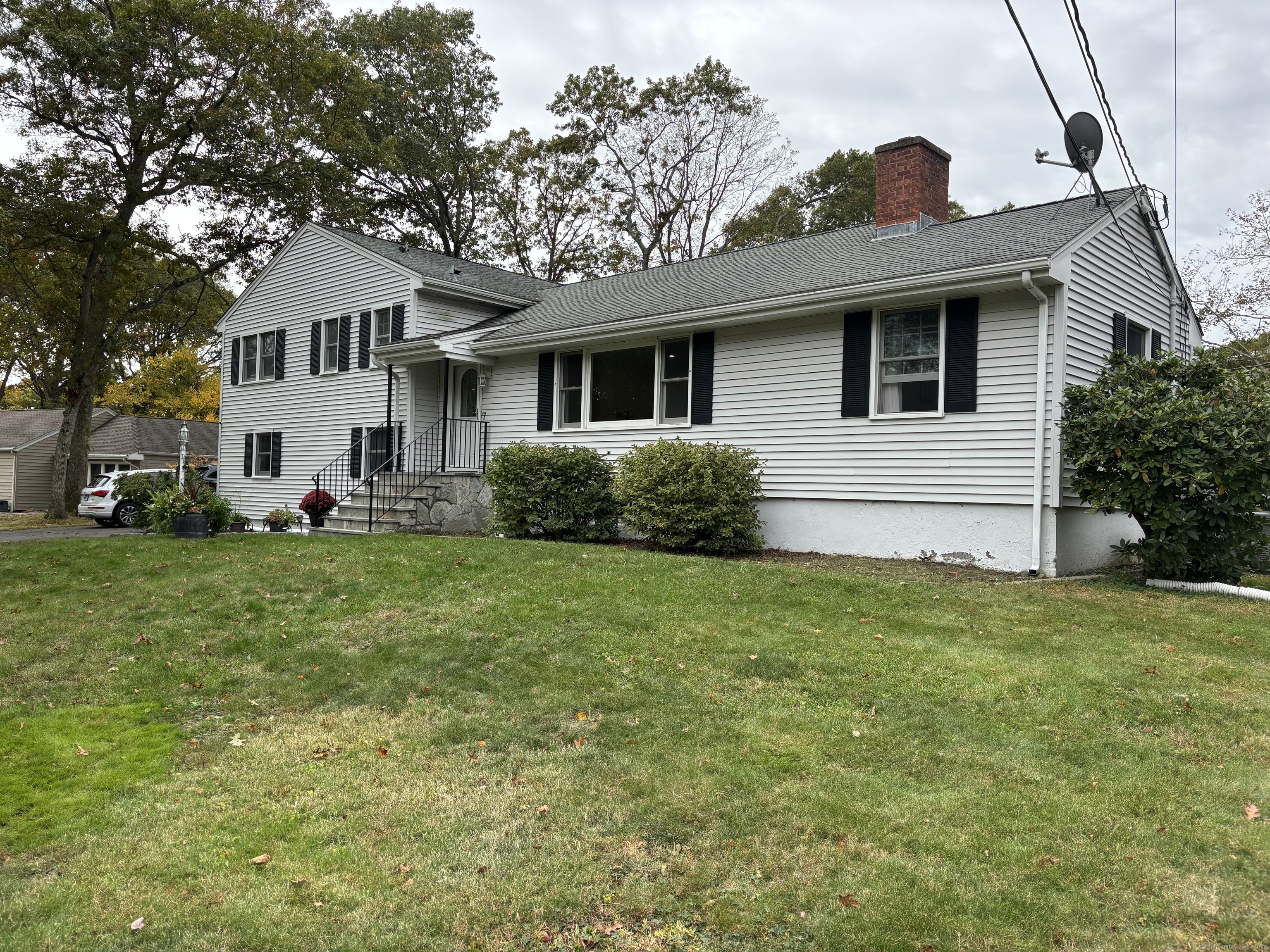 846 Beechwood Road Orange, CT 06477 - Photo 4 of 25 a front view of a house with garden