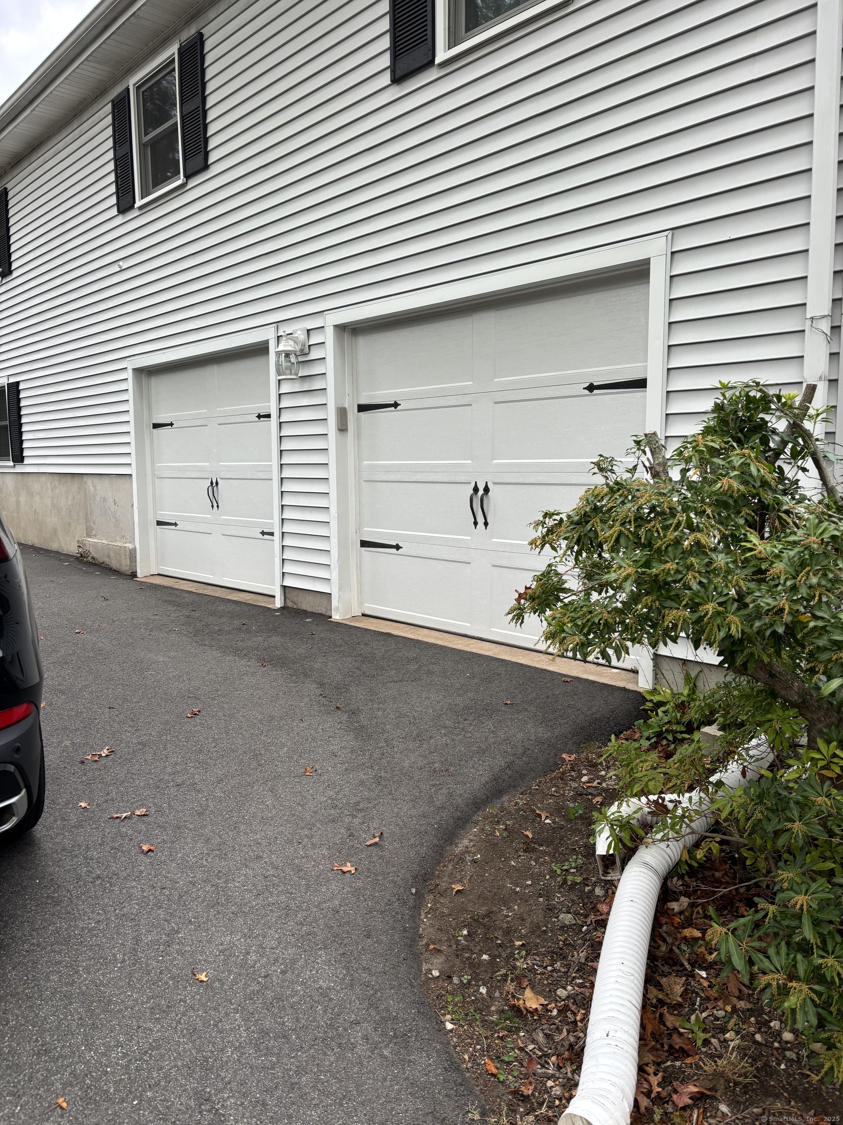 846 Beechwood Road Orange, CT 06477 - Photo 6 of 25 a view of a house with a garage