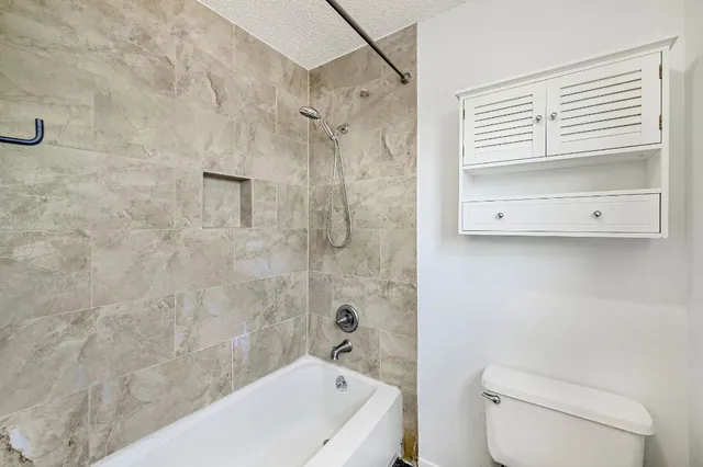 a bathroom with a bathtub and a shower