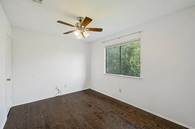 a view of a room that has a window in it