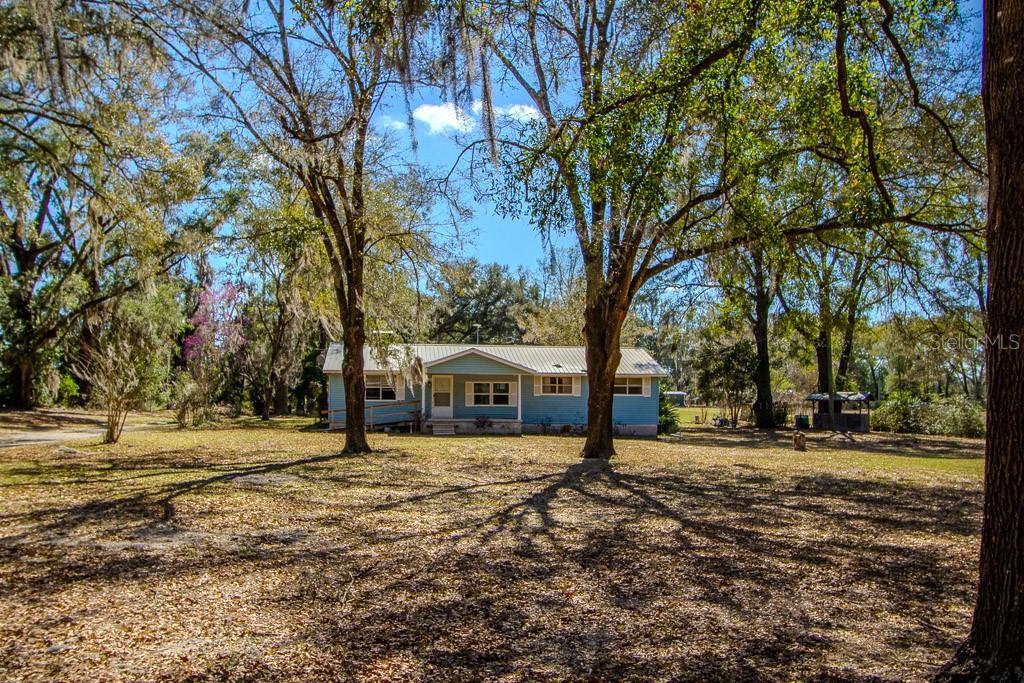 23809 Northwest 206th Avenue High Springs, FL 32643 - Photo 1 of 1 a view of a house with a yard