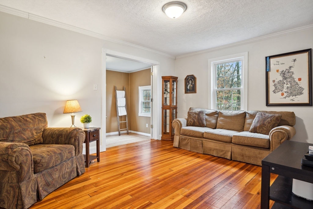 162 Proctor Road Chelmsford, MA 01824 - Photo 12 of 35 a living room with furniture and a wooden floor